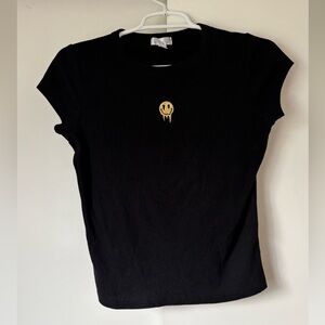 Black ribbed top with embroidered dripping smiley face